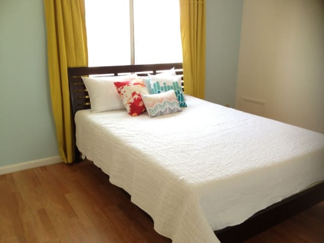 Sun filled condo near beach