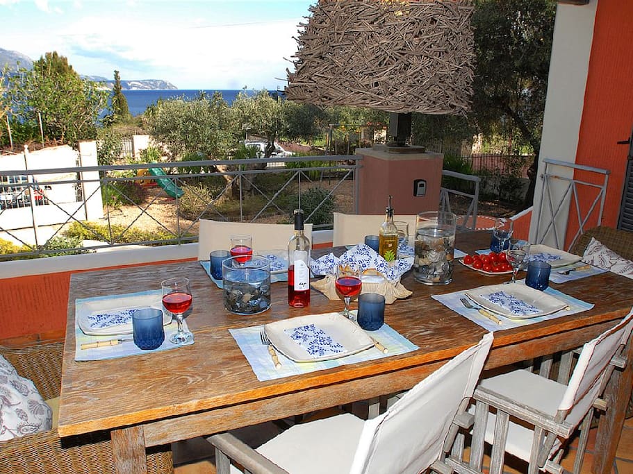 The main veranda, dining al fresco, most relaxing area of the house with an exquisite view of the sea!