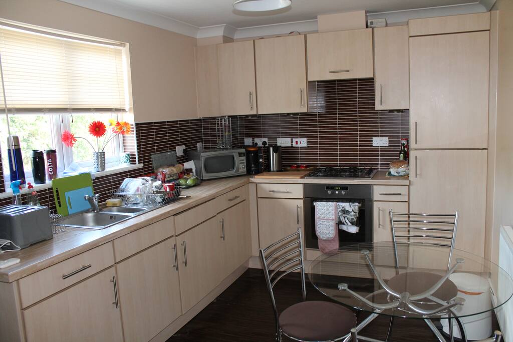 Shared kitchen with fridge-freezer, microwave, coffee machine, etc.