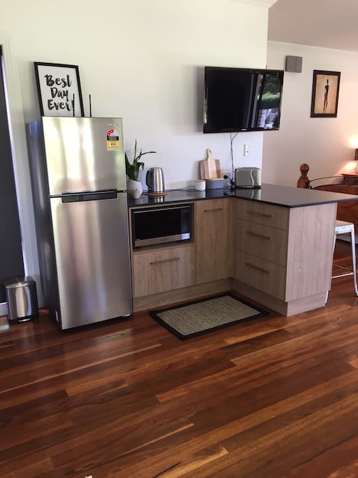 Full size fridge and new microwave, toaster jug and coffee machine