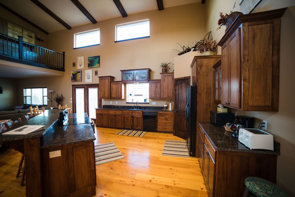 Kitchen complete with basic cooking supplies and utensils.