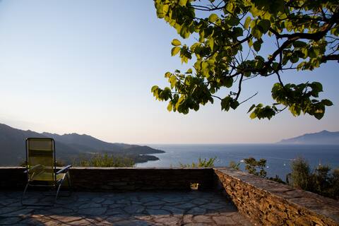 Stone villa overlooking town, sea and mountains