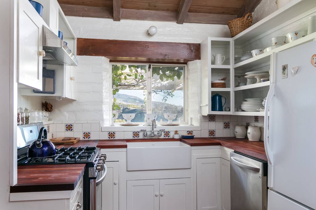 The kitchen has original cabinetry but updated appliances