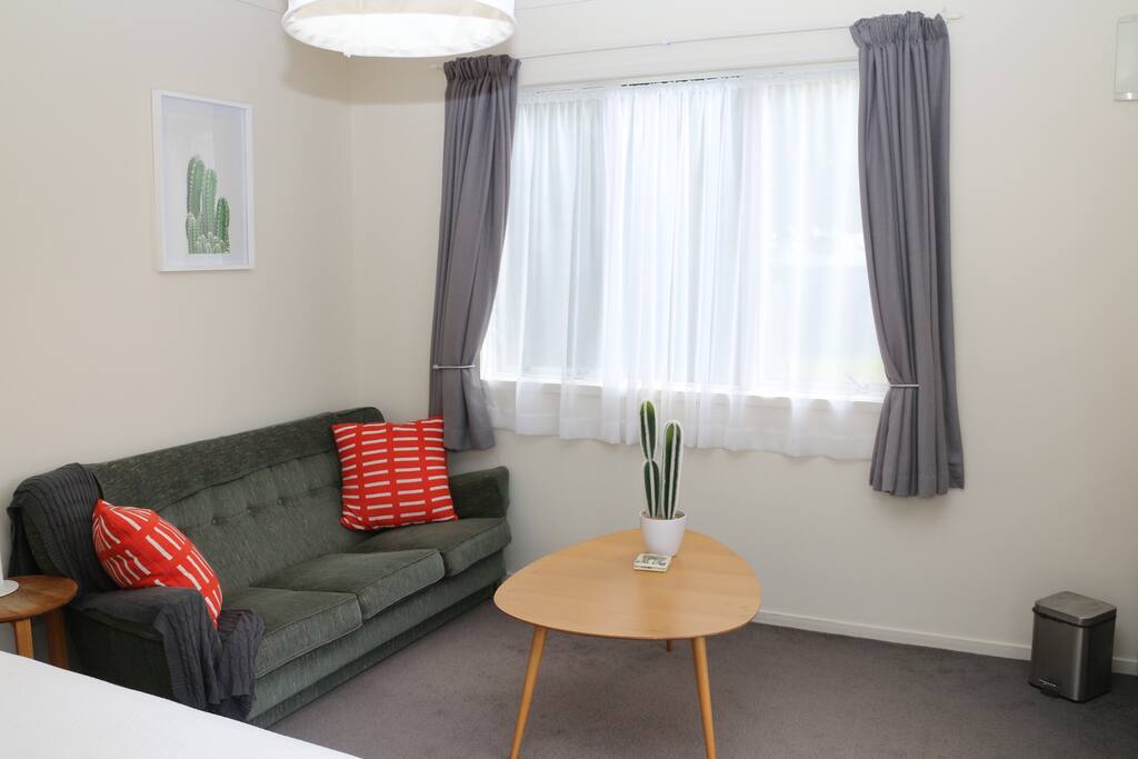 Inside your cabin/studio - modern, relaxed atmosphere with a vintage 70s feel. The cabin is spacious with couch and coffee table for relaxing. If extra guests are staying. Air mattress, floor mattress or cot can be placed in the room