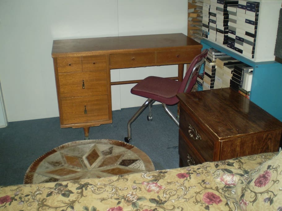 A desk is available for the guest's use.