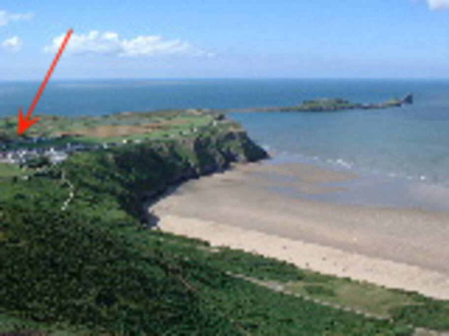 View from Rhosilli Downs overlooking The Worm ( arrow depicts cottage)