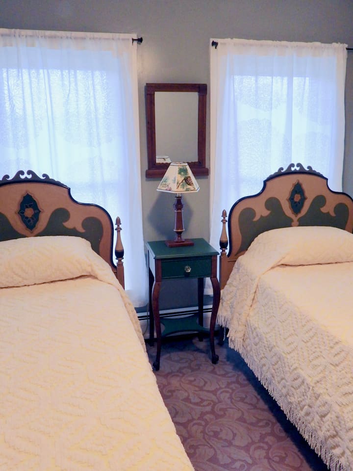 Two twin beds for $85 for the room with a shared bathroom