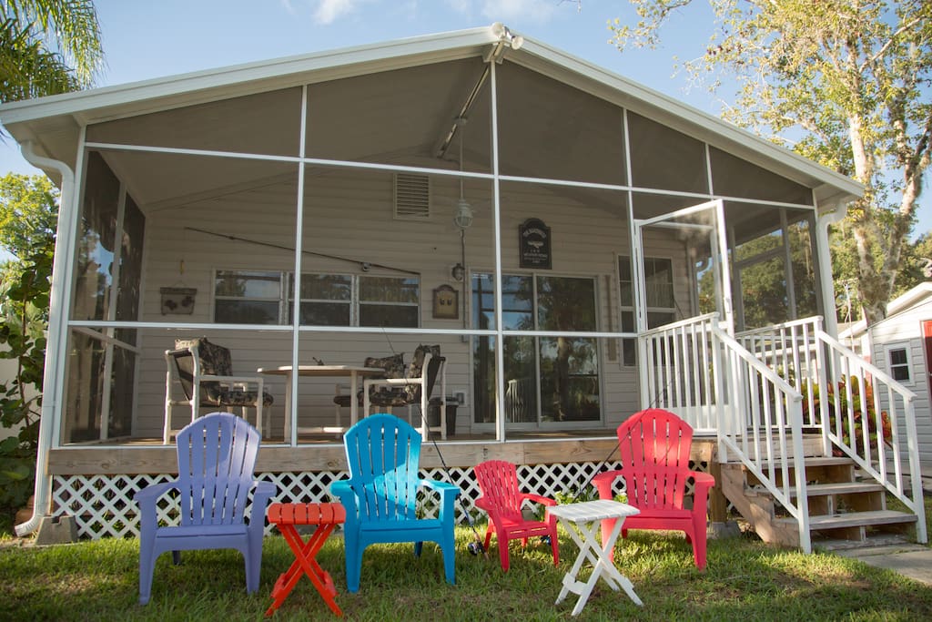 Back yard facing docks and water, plenty of out door chairs