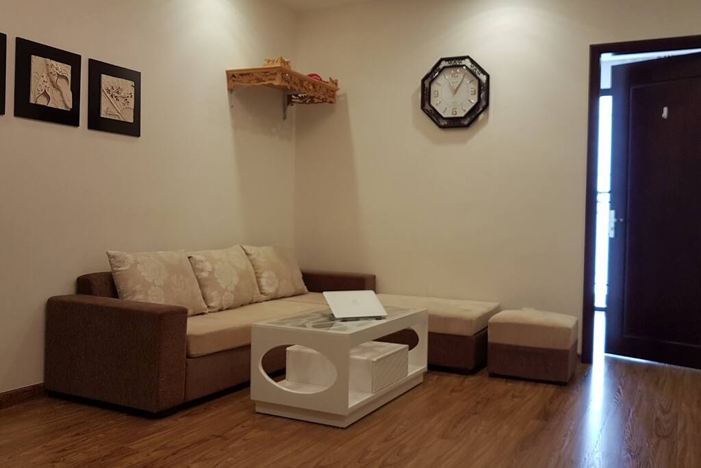 A cozy living room with comfortable beige sofas