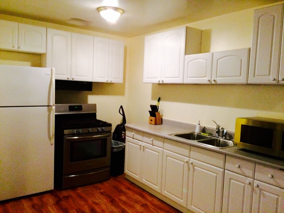 Kitchen includes crockpot, full fridge and stove, plates cups silverware, toaster, microwave, coffee pot, pots and pans, Dish soap and dish towels etc.