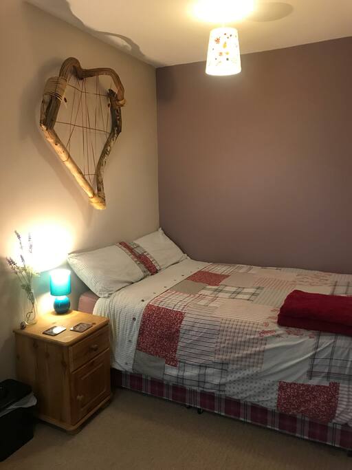 Double bed with bedside table