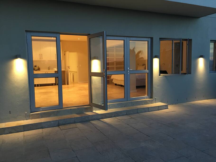 Double doors lead out to the pool