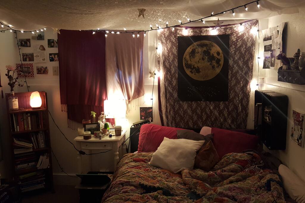 The bedroom! Includes full sized bed, dresser, small bookshelf, and night stand. There are also 2 small shelves on the wall next to the bed.