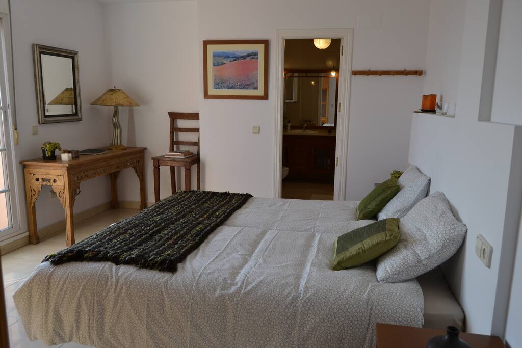 Room 1 has direct access to the terrace and private bathroom with shower and bathtub.