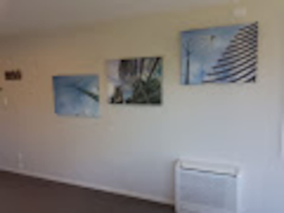 Lounge wall, views of Christchurch City Art Gallery. Heat pump heats and cools this studio.