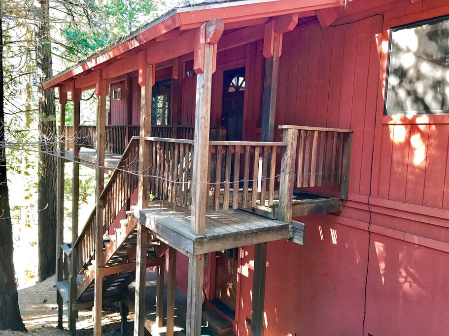 Stairs provide access to the main entry and basement doors