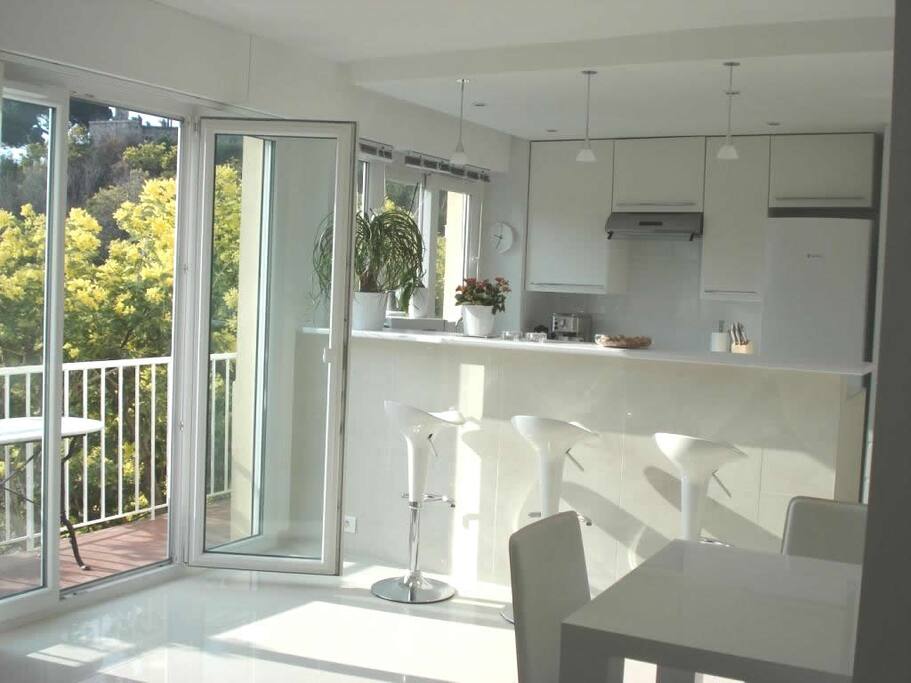 Open plan lounge / kitchen with a double glazed door leading to the balcony