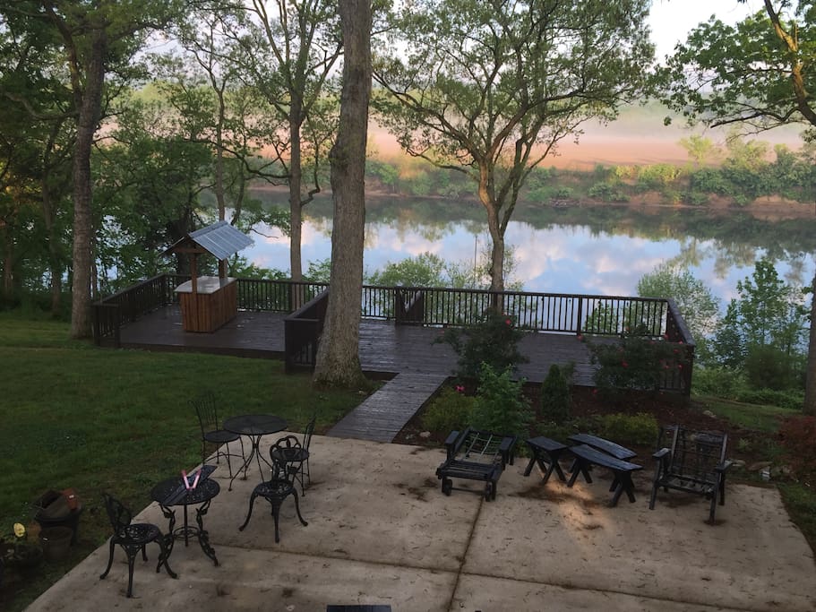 Outdoor living areas include two lower deck levels with tiki bar, large patio, and covered patio area. There also is a rear deck in the second level. There is a gas grill, exterior lighting and heater for outdoor enjoyment.