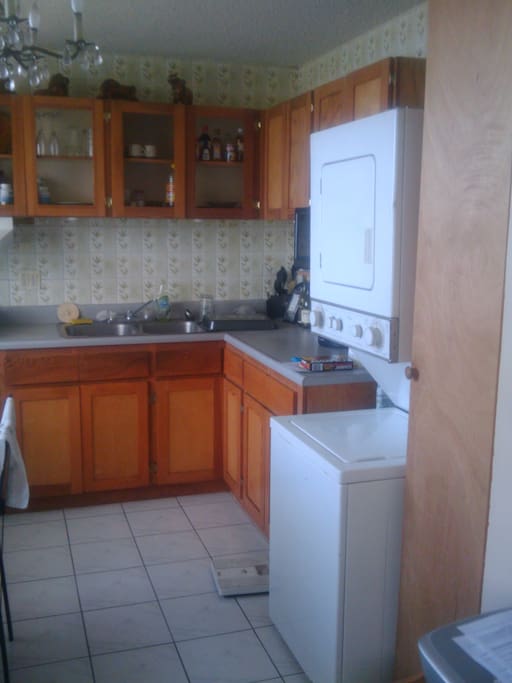 Kitchen with washer and dryer