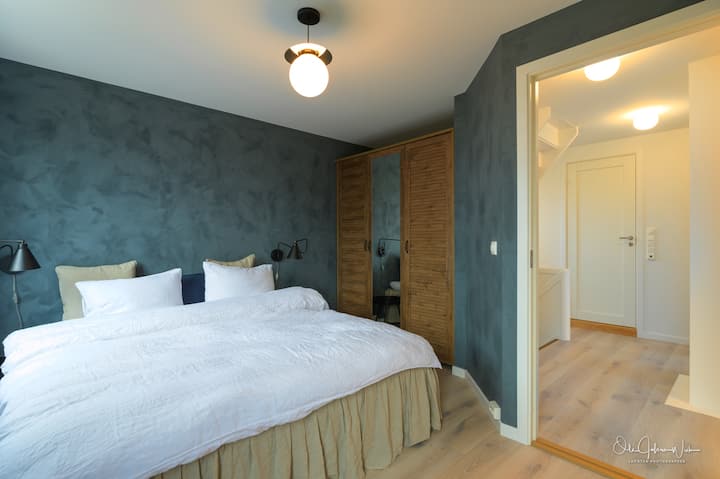 The blue master bedroom 1st floor