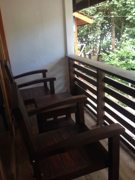 Balcony with teak chairs and table