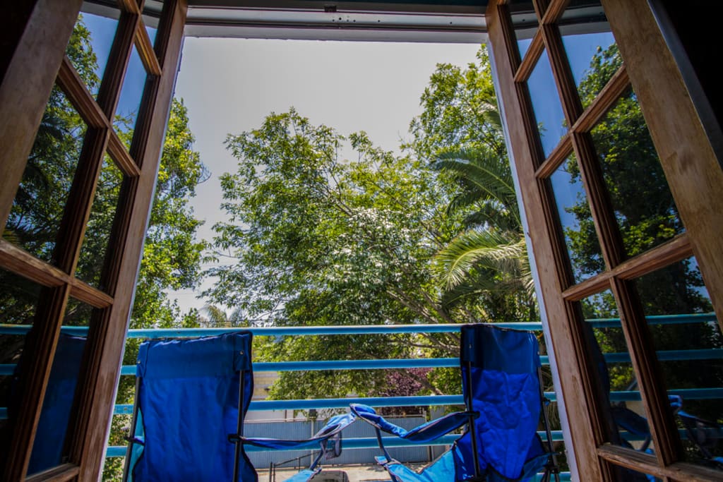 Small balcony is a nice place for a glass of wine after a hard day of beach fun.