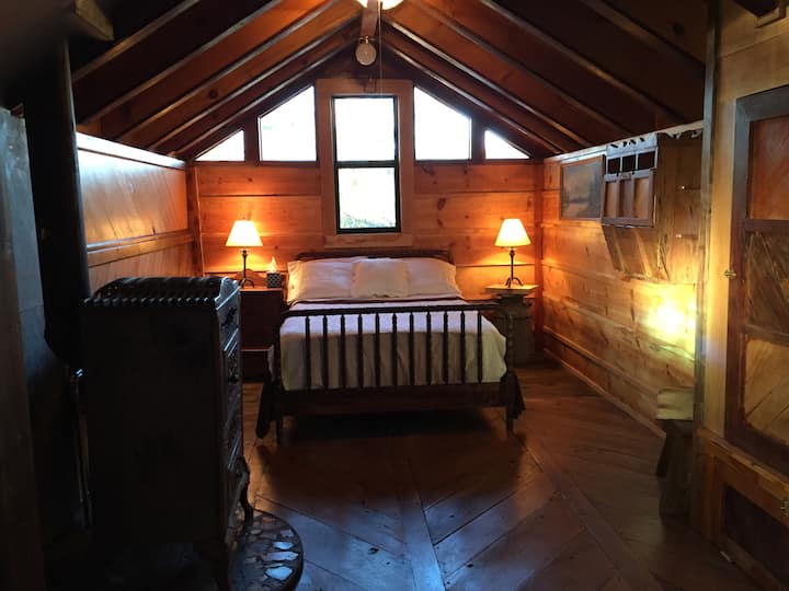 The downstairs bedroom has a full size bed.  The cabin is furnished with fluffy white linens