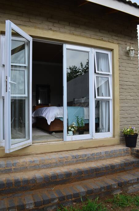 Private entrance to room through spacious garden.