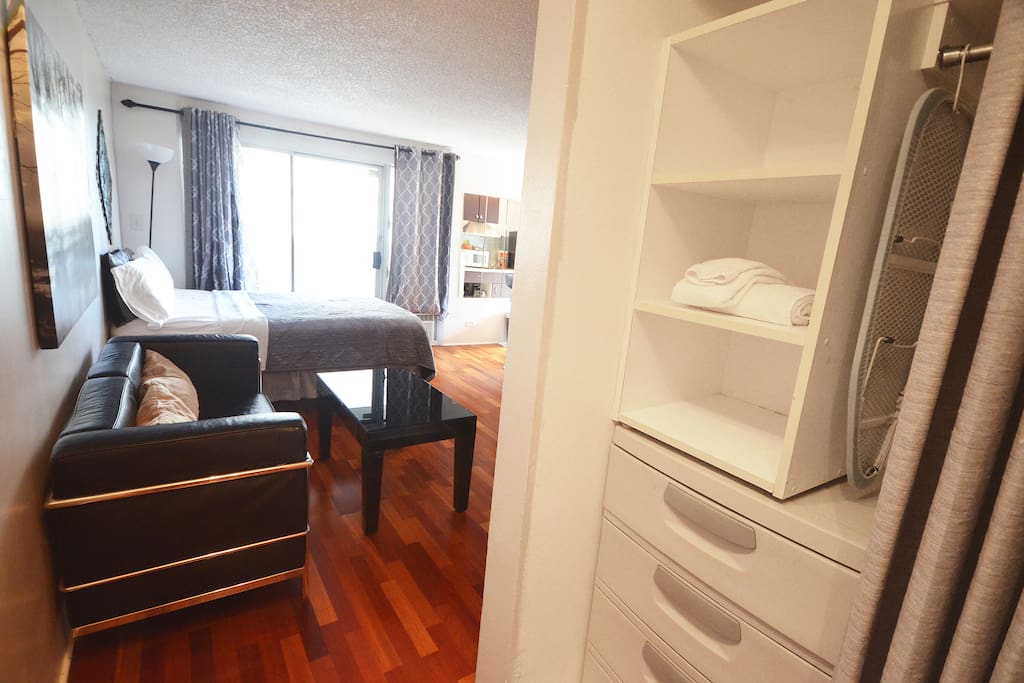 View from entering the room. Closet with dresser draws and hangers for personal items