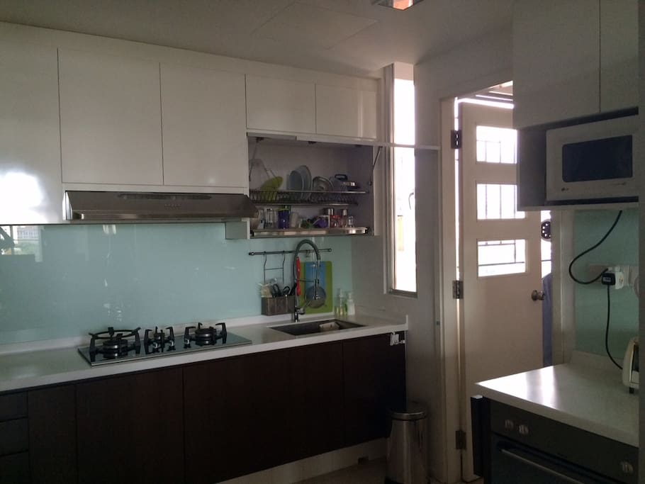 Kitchen, renovated in 2013. Stove, microwave, toaster, and conventional oven. Please note: There is NO dishwasher. Dishwashers are rare in Singapore.