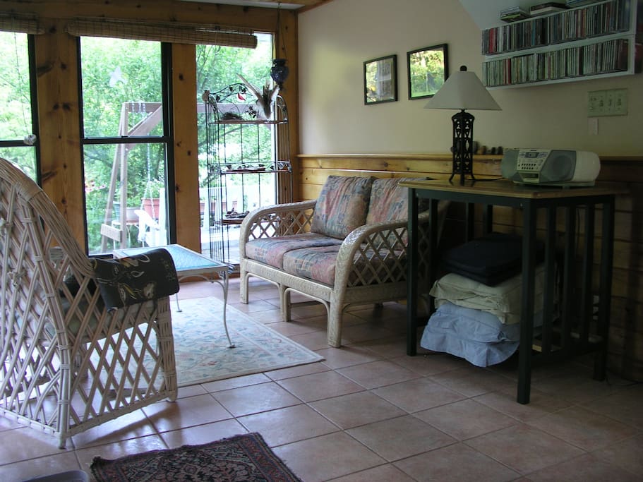 Enjoy morning coffee, books, and birds in the Florida room.