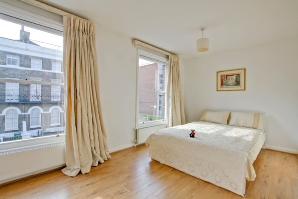 South facing room, bright and airy, flooded with sunshine in the morning, with a view over an historic corner of the neighbourhood.