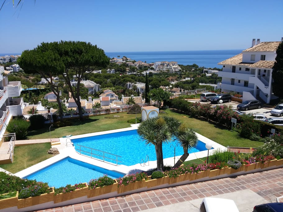 View of pool with buiding on the right