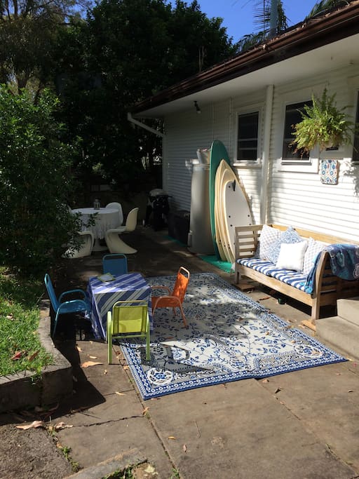 Backyard BBQ's including webber bbq, surfboards to use and a relaxing day bed that enjoys the morning sun.