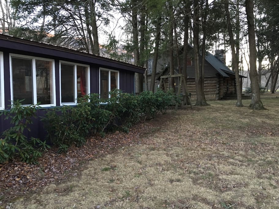 View of our log cabin from the tiny house