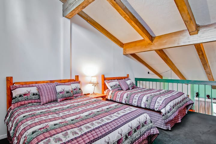 Two queen size beds in the loft area
