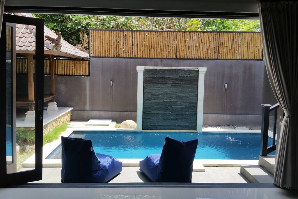 Pool view from spacious, semi open living room area