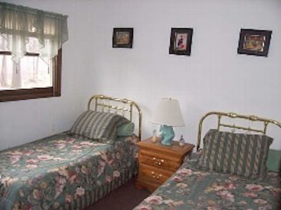 Bedroom with dresser and tv