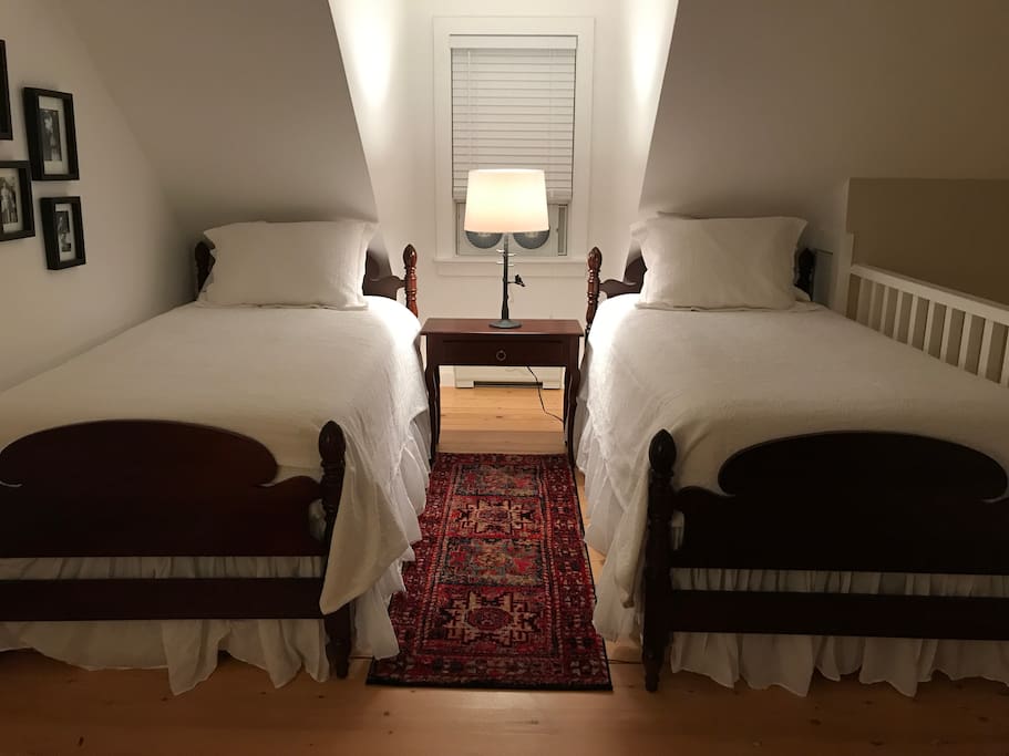 The twin loft bedroom has lovely vintage beds with new mattresses and high quality linens.