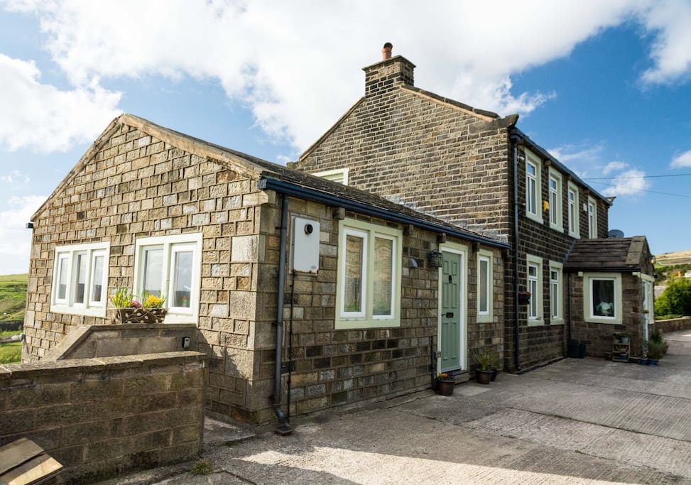 Front of the lodge and house and the lodge driveway