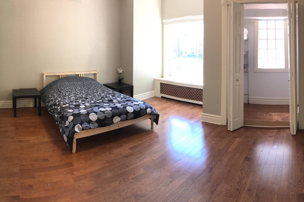 Large bright airy Master bedroom with a Full size bed, 2 closets, high Victorian ceilings throughout the space. We have recently updated this space with new bedding, mattress and frame. We continuously enhance all of our rooms to bring you even greater comfort with a clean and spacious modern designs, technologies and amenities.