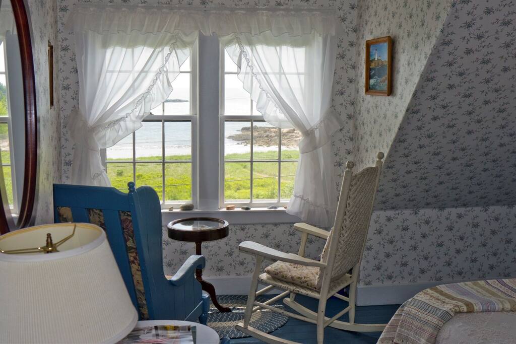 Room 5's view over the ocean beach and crashing surf in the 1860's Sea Captain's house at Acadia's Oceanside Meadows Inn on the coast Maine.