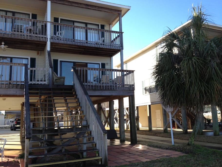 Back of unit. Decks from the living room and bedroom. Steps to Little Lagoon!