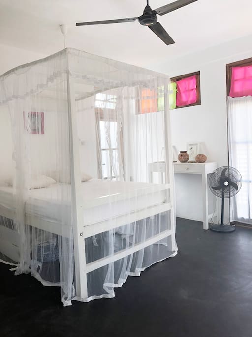 Super comfortable bed with mosquito net.