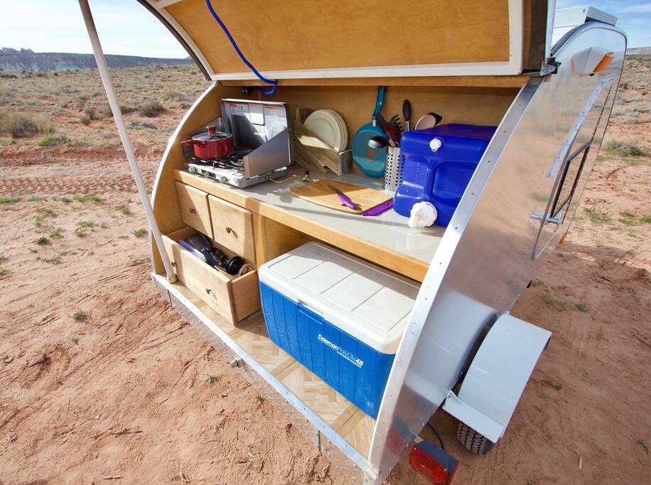 The kitchen has everything you need to cook your own meals, including a sink with running water (not pictured).