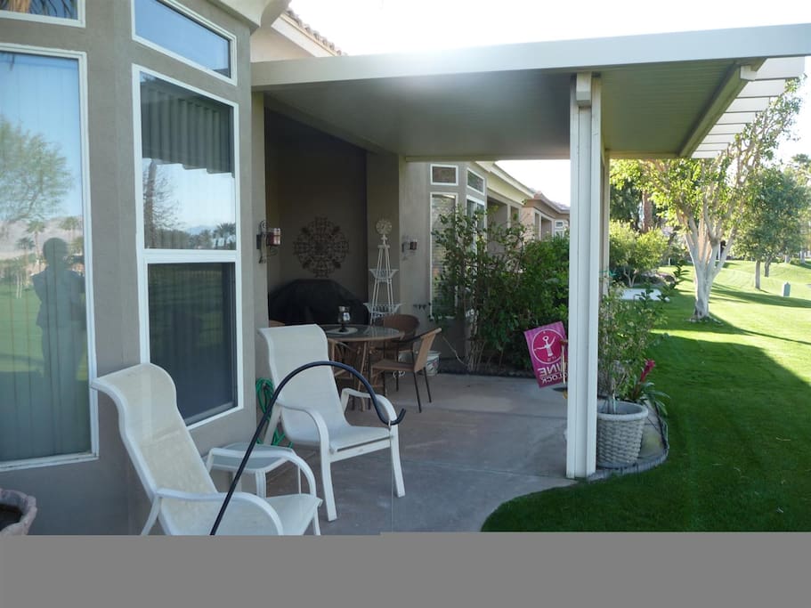 Relax and watch the golfer's on back patio....