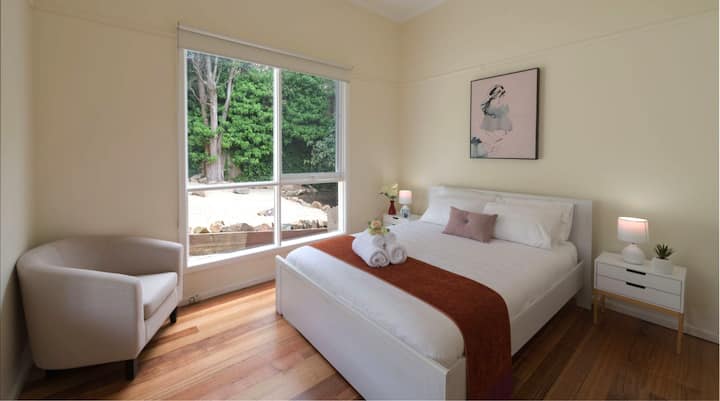 Master bedroom with garden view. Linens and towels are professionally laundered.