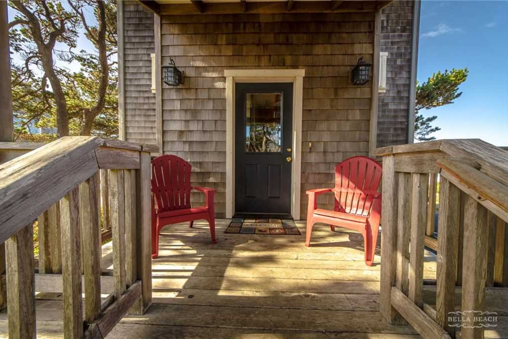 Front door with two Adirondack chairs, perfect for morning coffee in the sunlight