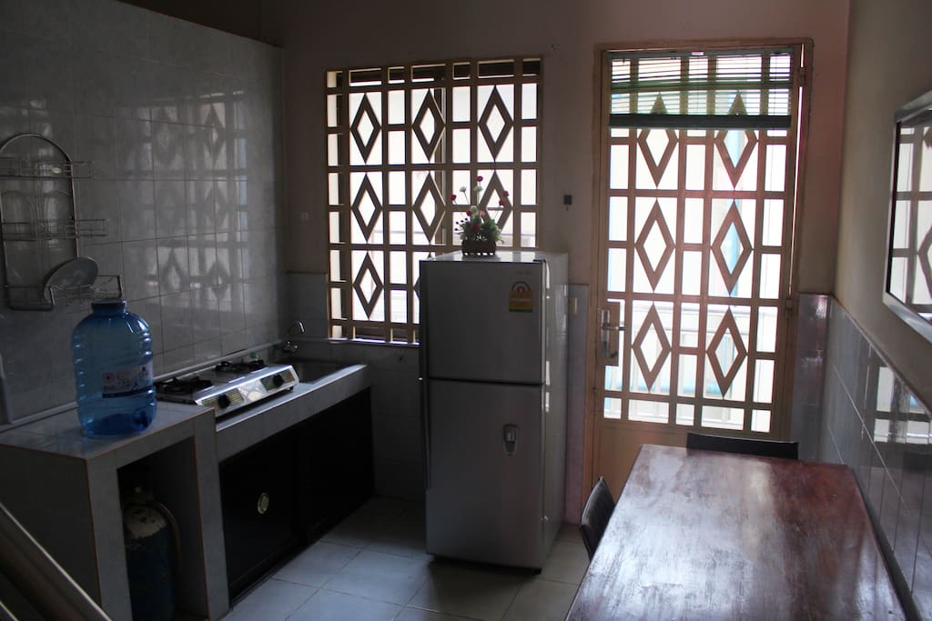 Full size refrigerator, cook top and dining table. washing machine on back deck.