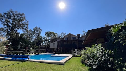 Country house with a swimming pool, terrace, and green areas